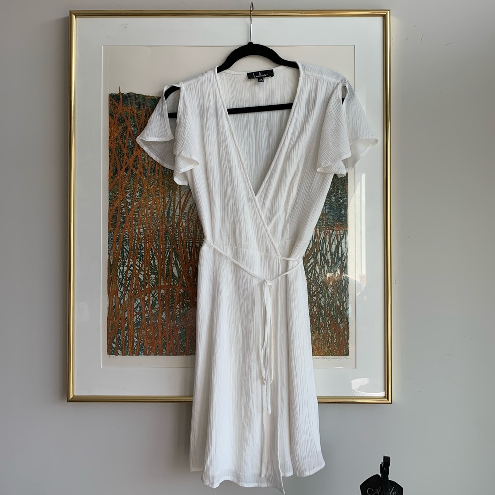 white mini wrap dress with flutter sleeves